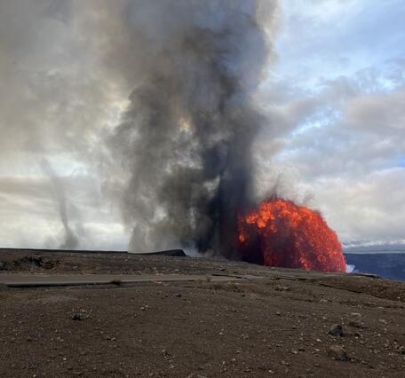 Color photograph of lava fountain and fallout