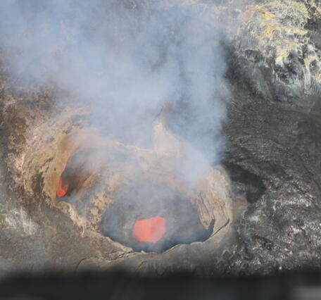 Color photograph of molten material within volcanic vent