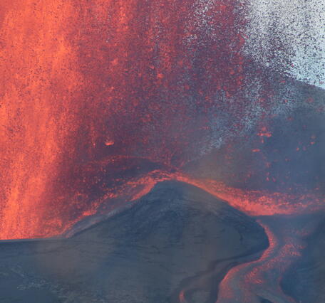 Color photograph of lava fountain and channelized lava flow