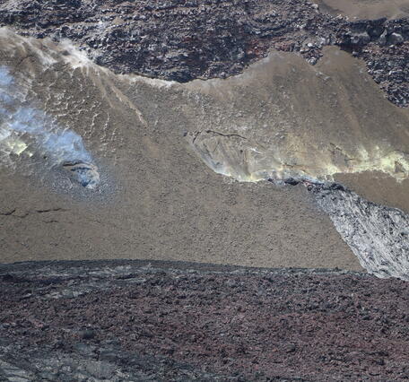 Color photograph of volcanic vents in wall of crater