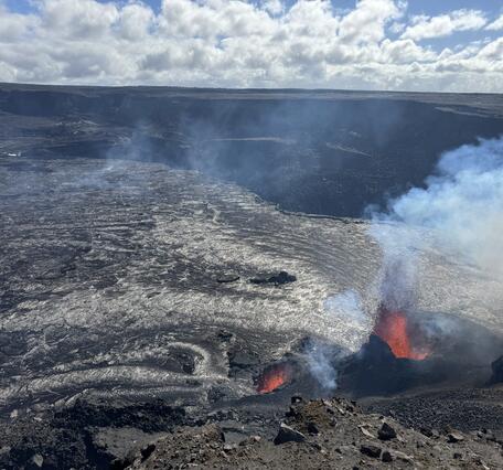 Color photograph of vent erupting