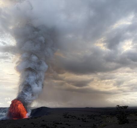 Color photograph of lava fountain and volcanic plume