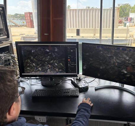 Two computer screens showing the seafloor