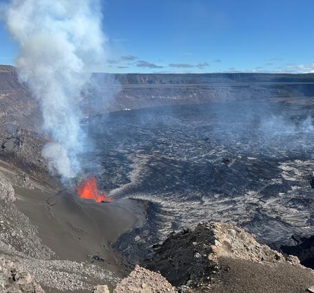 Color photograph showing erupting vent