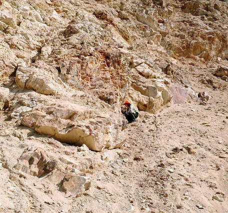 Geologist conducting field work at the gold-antimony-tungsten mining area