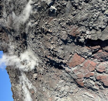 Color photograph of a wall of rock 