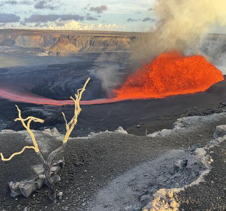 Color photograph of lava fountain and flow