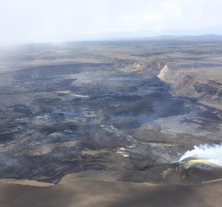 View of volcanic vents degassing within crater