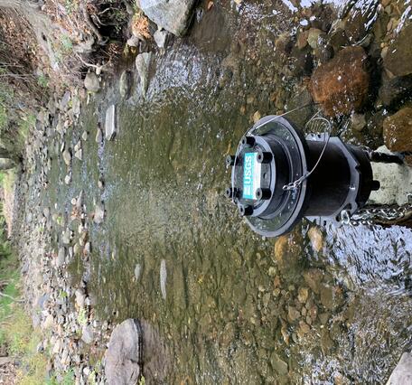Scientific instrument sitting in a river