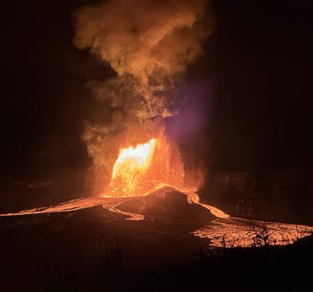 Color photograph of lava fountain and lava flows