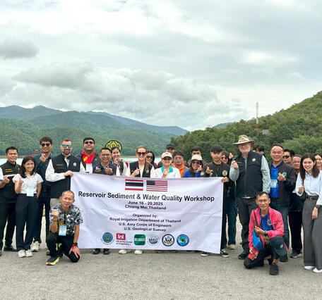 Participants in the water quality workshop gather on the Mae Ngat Somboon Chon Dam, Chiang Mai Province, Thailand 