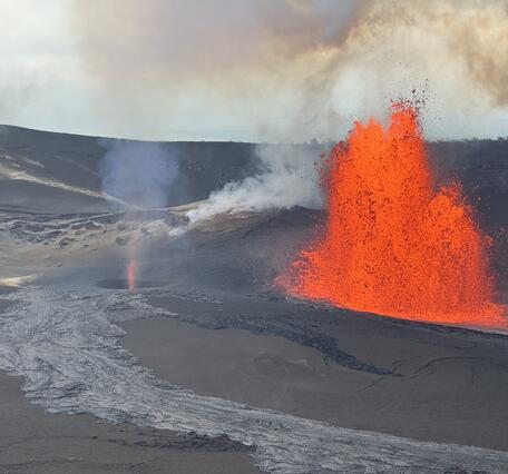 Color photograph of lava fountain and volcanic gas jet