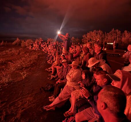 Color photograph of eruption viewers at night