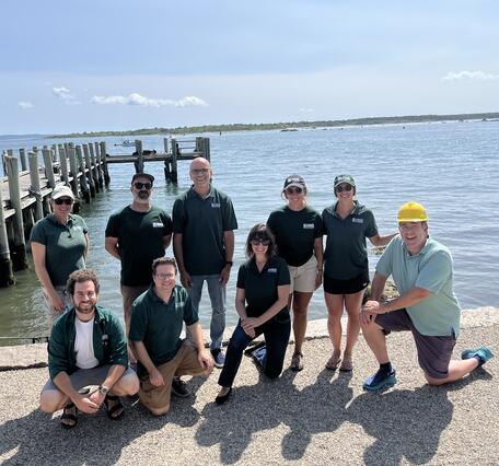Group photo with the ocean in the background