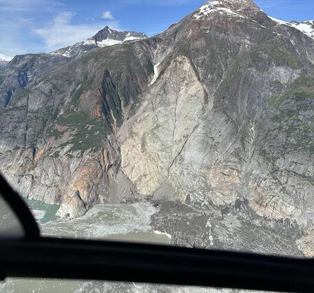 Aerial photo of steep mountainside showing the landslide source area.