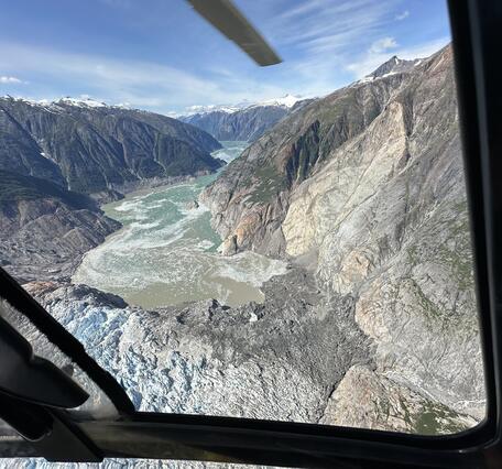 Aerial photo of landslide deposit at bottom of mountain and into the water