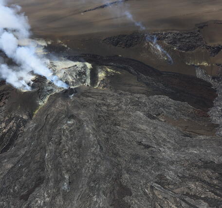 Color photograph of volcanic vents degassing