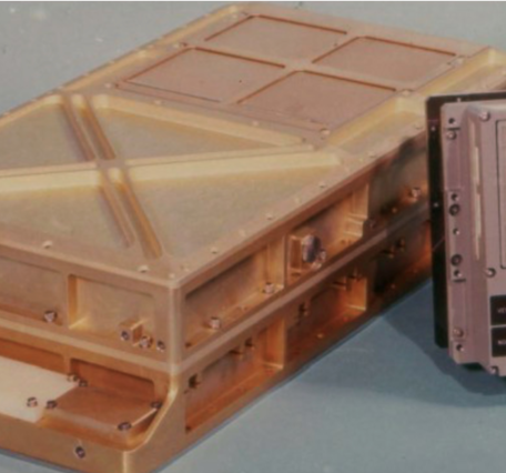 Photo of Apollo Guidance Computer (a gold box with attachments, left) and the DSKY (a gray box with buttons)