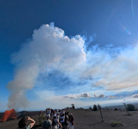 Visitors watch lava fountain at national park viewing area