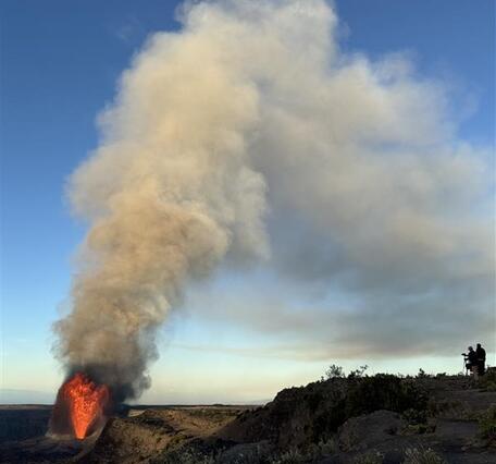 Color photograph of lava fountain and eruption plume
