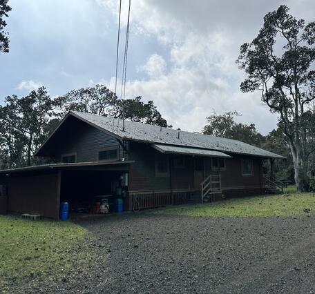 Color photograph of tephra on a house