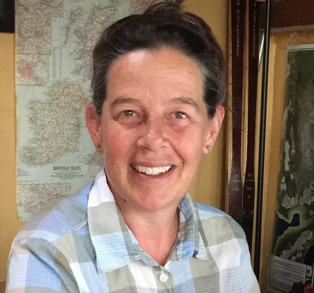 portrait of Lesleigh Anderson in front of map