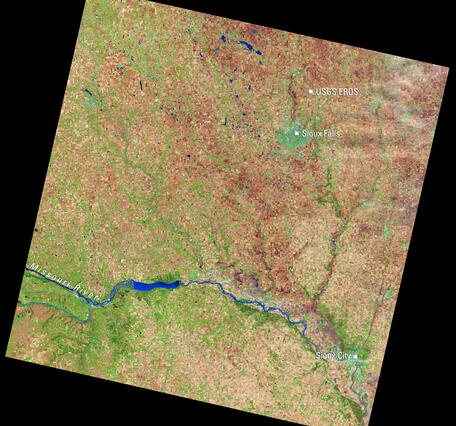Satellite image of eastern South Dakota showing Sioux Falls, the USGS EROS Center, Sioux City, and the Missouri River.