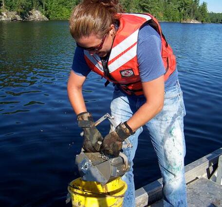 Graduate student working on a lake sturgeon project