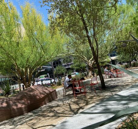 Park off Las Vegas strip surrounded by green trees and blue sky
