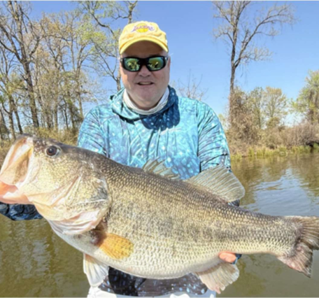 Researcher holds a black bass