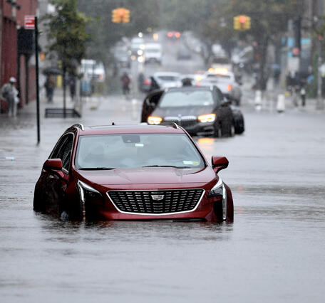 Abandoned cars on a flooded street in Brooklyn, NY.