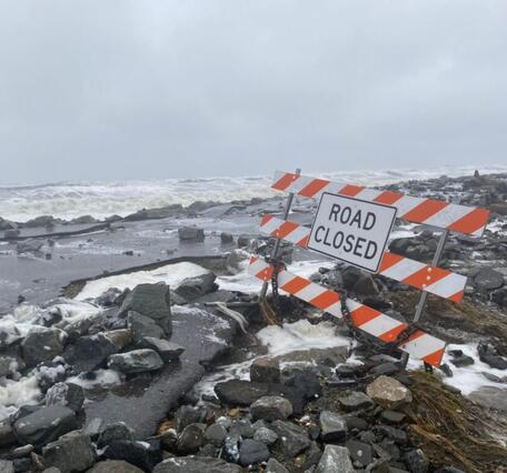 Photo of a road damaged by storm surge during Typhoon Merbok