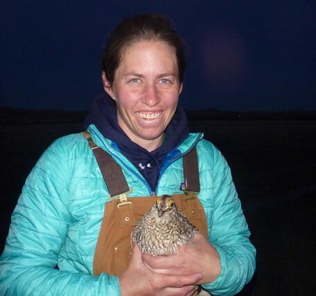Megan Milligan holding a bird.