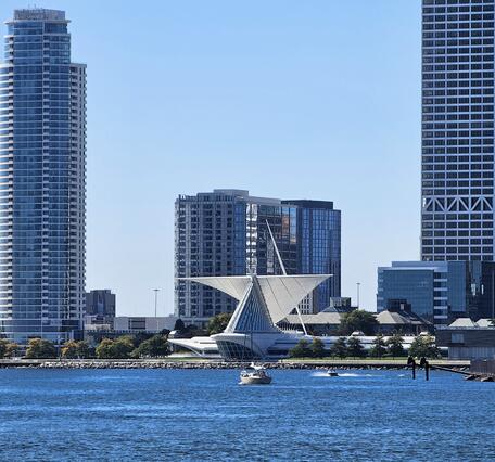 Milwaukee Harbor in foreground with Discovery World building and other tall buildings in background