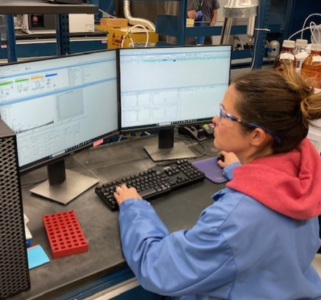 Chemist running quality assurance process on computer