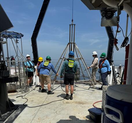 People on deck of ship working with mega multicorer