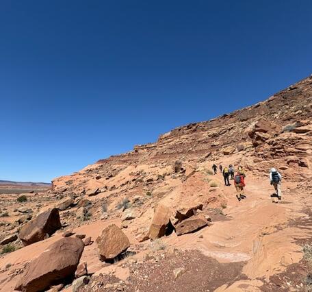 Geologists and members of the Navajo Nation conduct geologic mapping fieldwork.