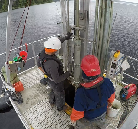 Photo of scientists at Ozette Lake operating the Uwitech coring platform