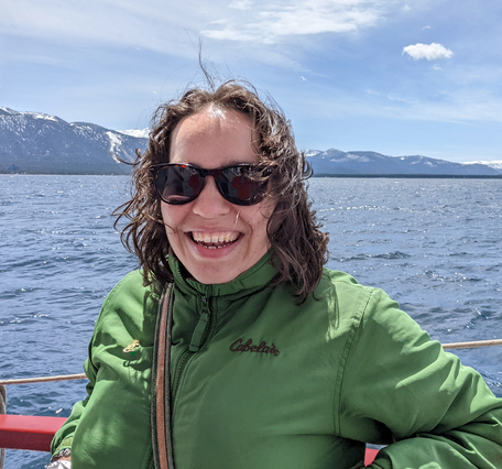 White woman with sunglasses on looking at camera