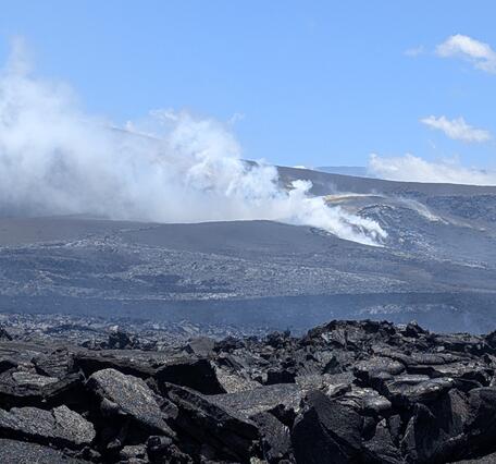 Color photograph of degassing volcanic vents