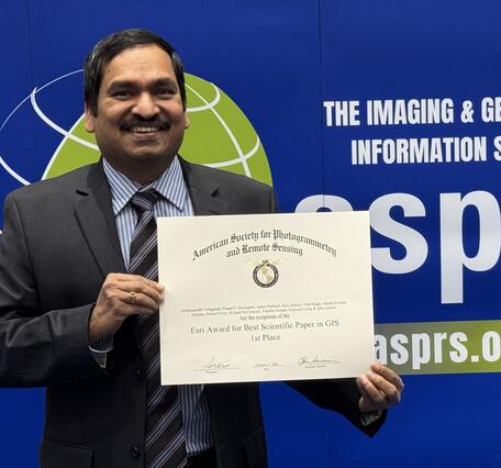 Pardhasaradhi Teluguntla receiving certificate of ESRI's Award for Best Scientific Paper in GIS -1st Place