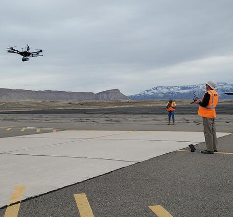 Drone being controlled by pilot at Grand Junction (Colorado) Airport