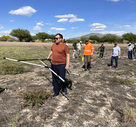 USGS hydrologist leads a field demonstration of a new subsurface geophysics tool