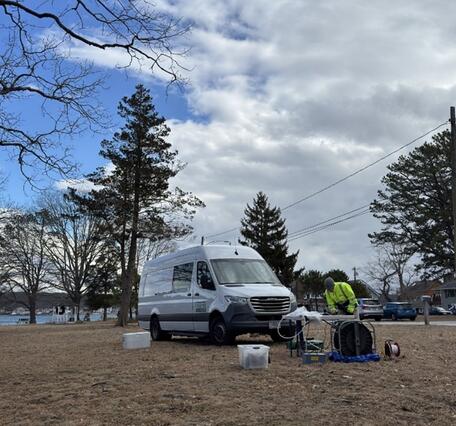 Collecting groundwater samples from a monitoring well. 