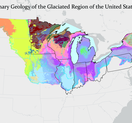 Grey background map of the US and Canada focused on the region around the Great Lakes with geologic map overlay in a variety of colors. 