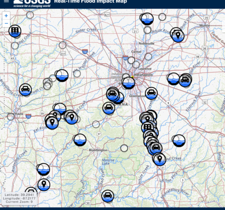 Screenshot of RT-FI Mapper showing numerous active flood impact locations including buildings, roads, and bridges