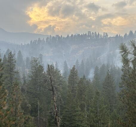 The Rail Ridge Fire burns in the distance in Oregon