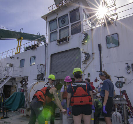 Scientists with a box core sample during the Hawaii Abyssal Nodules Expedition