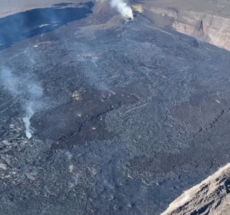 Color photograph of volcanic crater with vents and lava flows
