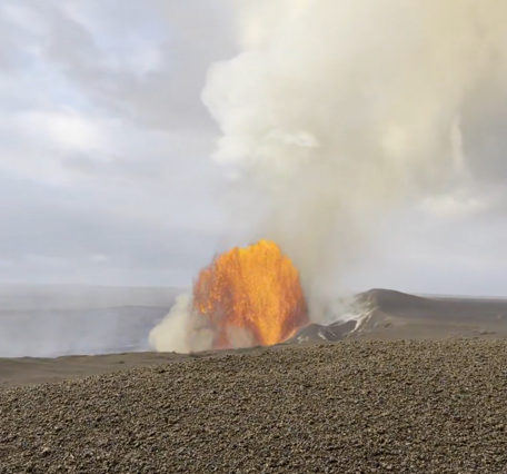 Color photograph of lava fountain within crater